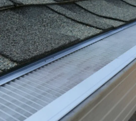 All-metal gutter guard installed along a clean gutter to keep leaves and debris out